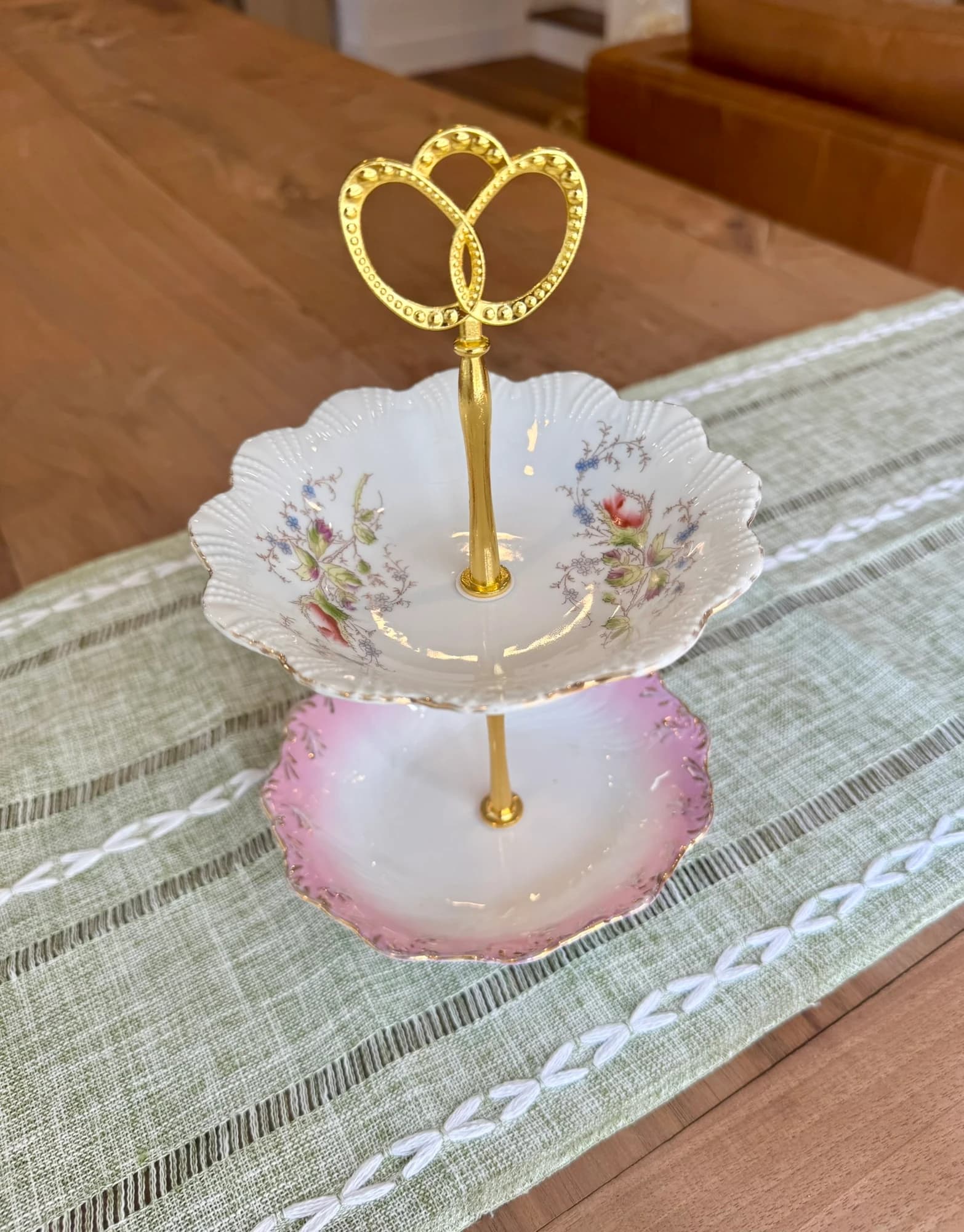 Vintage pink and floral two tiered jewelry stand.
